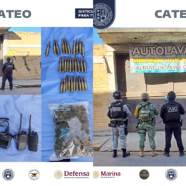 Elementos de la Agencia de Investigación Criminal realizan un cateo en un autolavado de la colonia 10 de Abril, en Temixco.